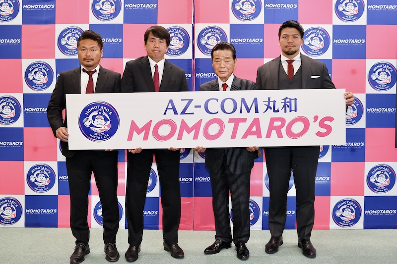 『AZ-COM丸和 MOMOTARO’S』として前へ。前明大の伊藤宏明氏がHC。プレーイングコーチに日本代表44キャップの木津武士